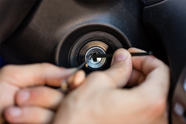 An image of a locksmith working on a cars ignition